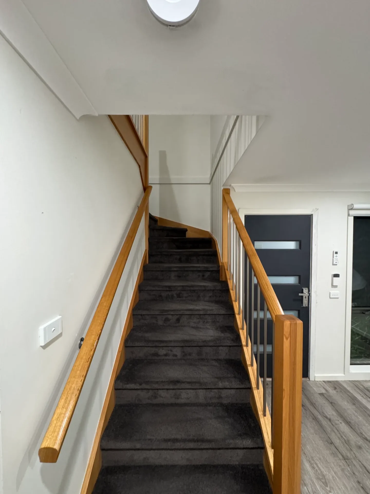 Timber staircase renovation with modern railings
