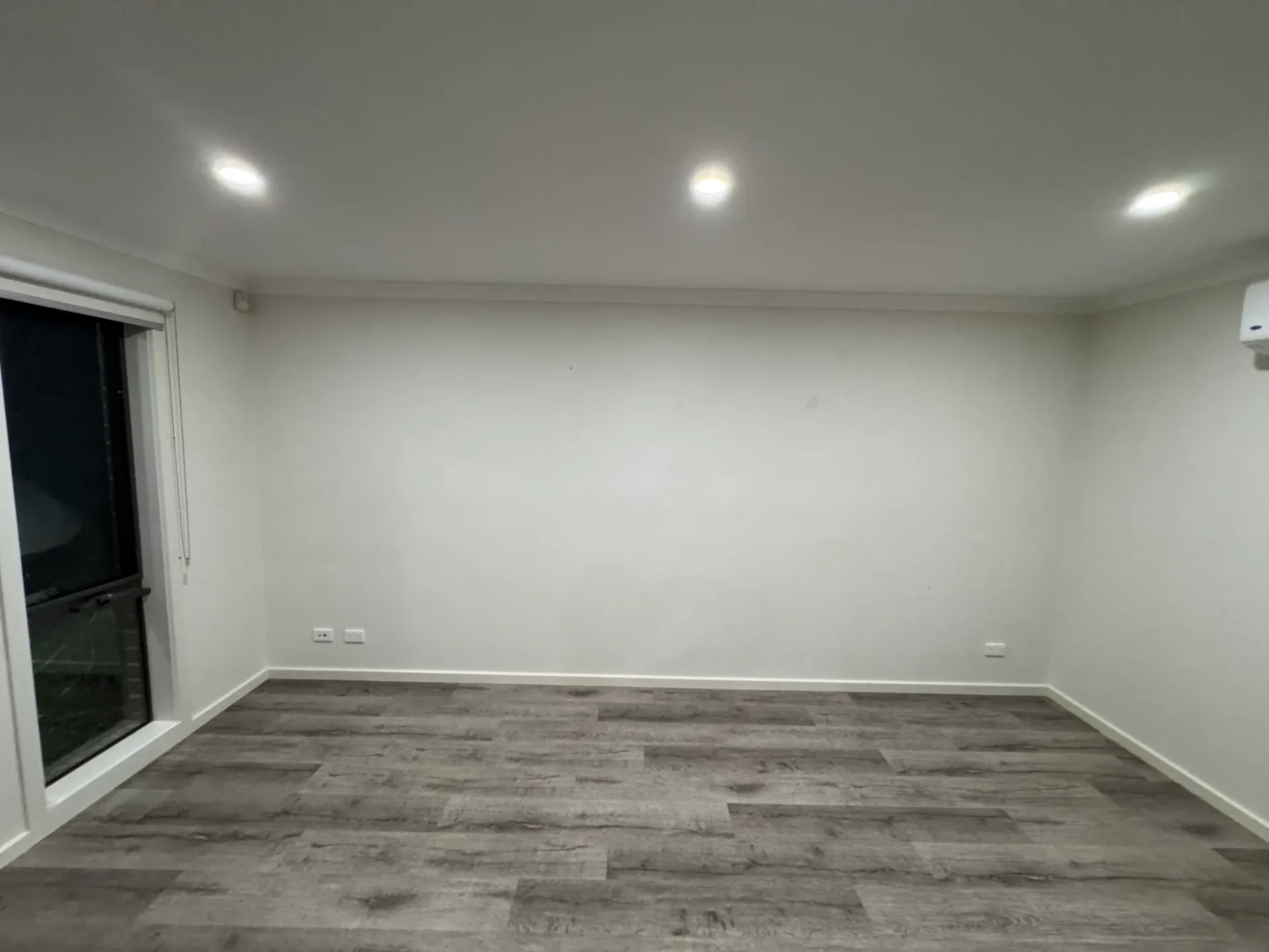 Spacious room with fresh paint and timber flooring