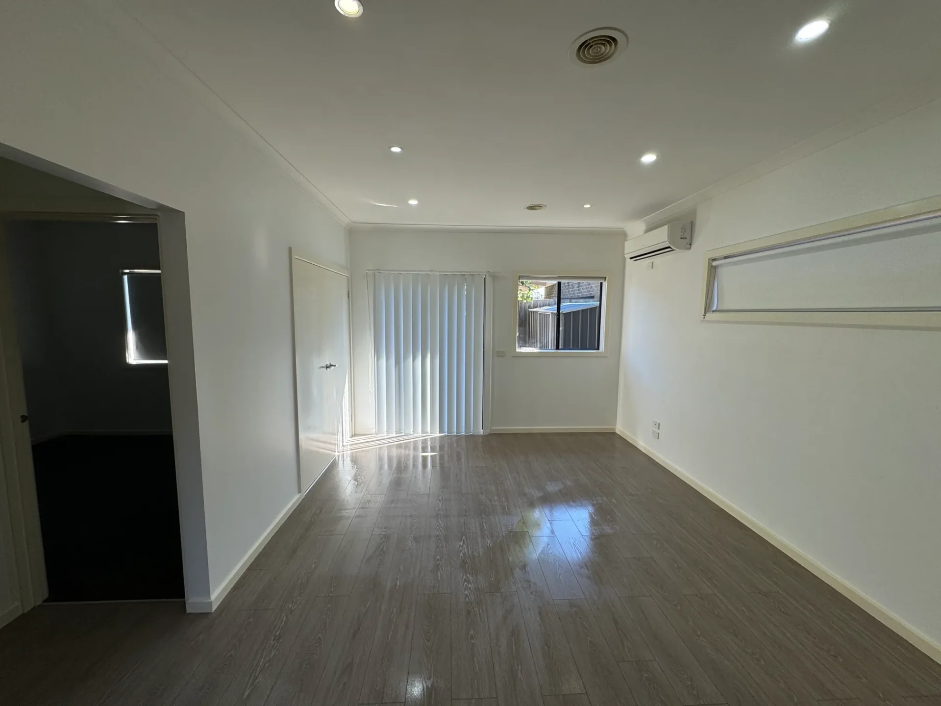 Clean, freshly renovated interior with polished floors and bright natural lighting